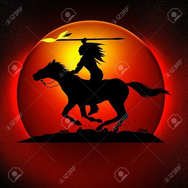 Silhouette of Native American Indian riding horseback with a spear.