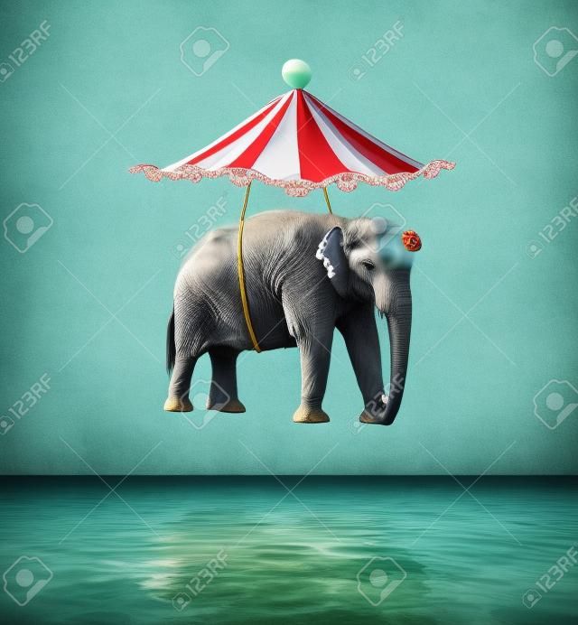 Imagem fantástica e artística que representa um elefante voador com tenda de circo acima da água