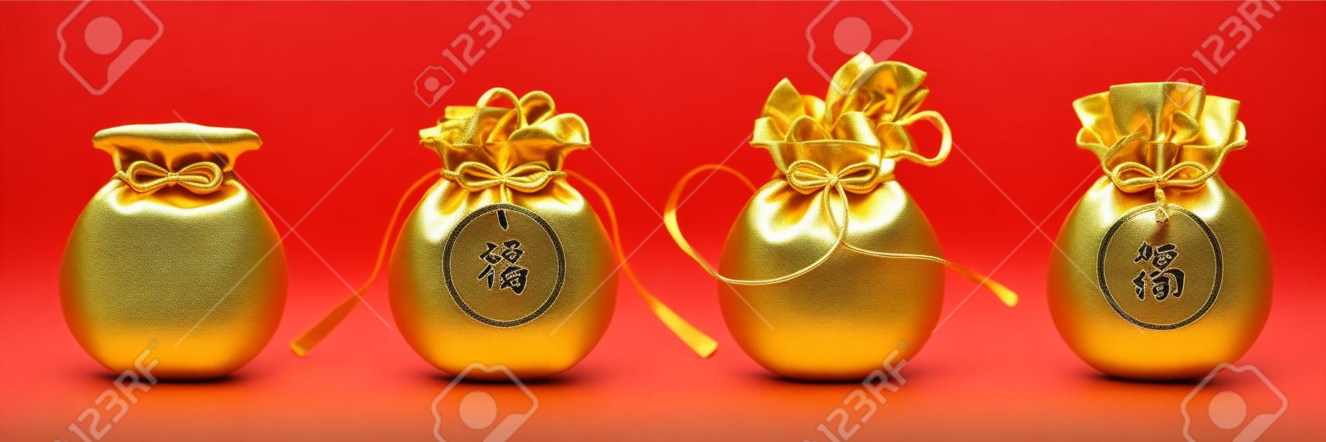 Bag with ribbon or sack with tassels, pouch with golden ingot, packet with money or hangbao, sac with chinese hieroglyph that means Good Luck or Fortune. 2020 CNY or china new year holiday