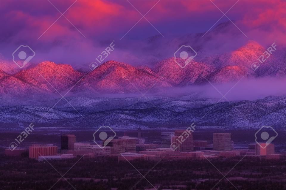 Colorado Springs, Colorado, USA downtown skyline and mountains at dusk.