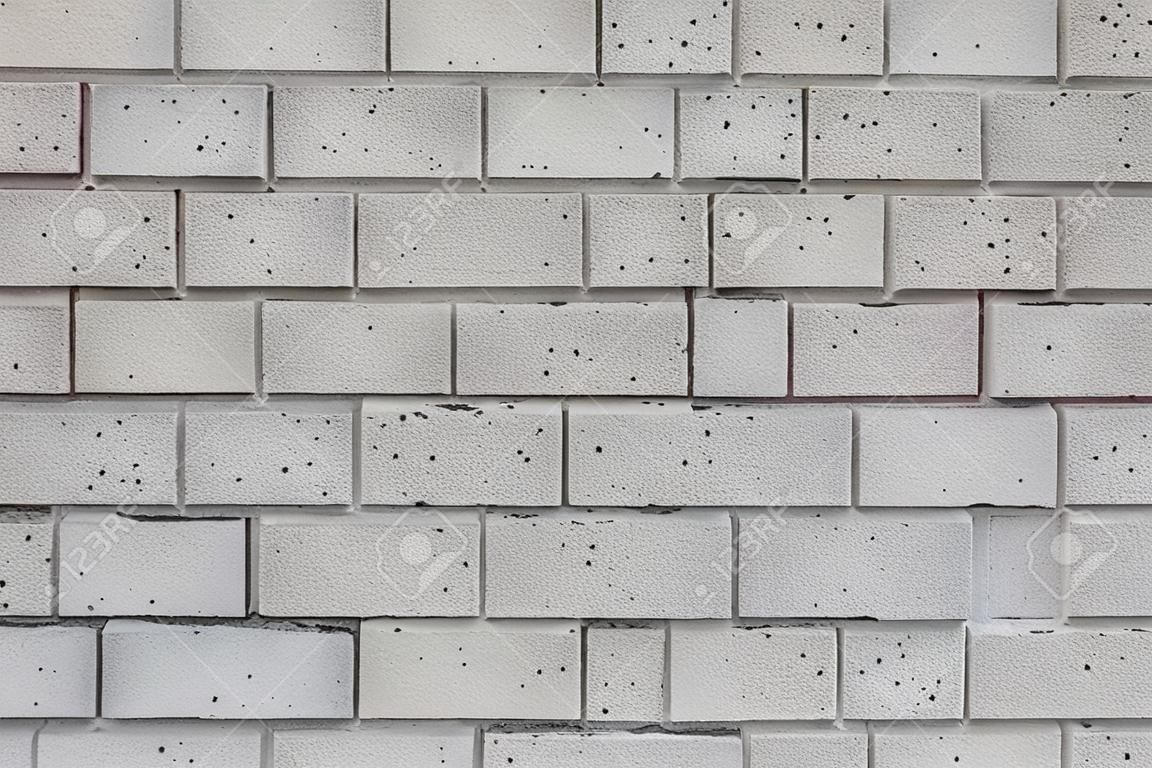 Primer plano de un muro de cemento gris ceniza bloques de un edificio de la escuela pública.