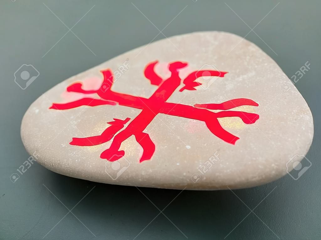 Fortune telling  with symbols on stone on grey background