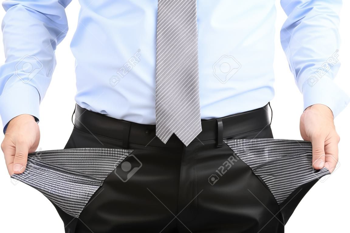 Business-Mann zeigt seine leeren Taschen, isoliert auf wei?