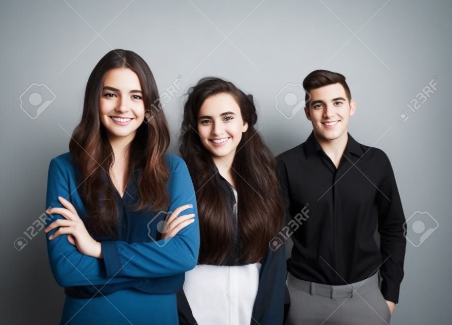 Portrait of young people against white wall background