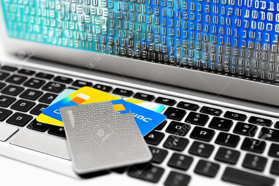 Credit cards on laptop keyboard, closeup