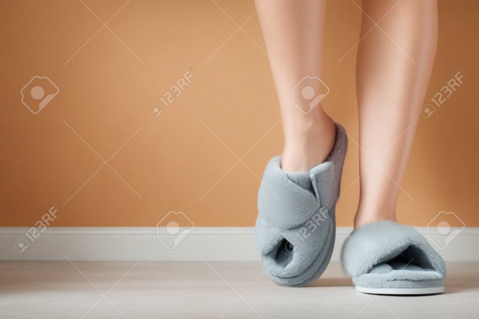 Woman in soft slippers at home