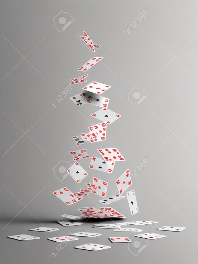 Playing cards falling on white background