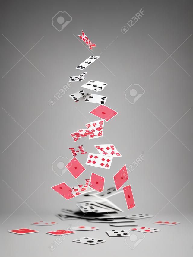 Playing cards falling on white background