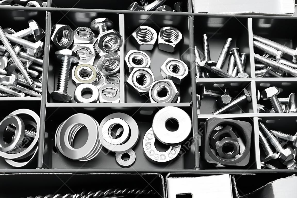 Nuts, bolts and screws in box,bolts and nuts in carton,Assembly kit,close-up
