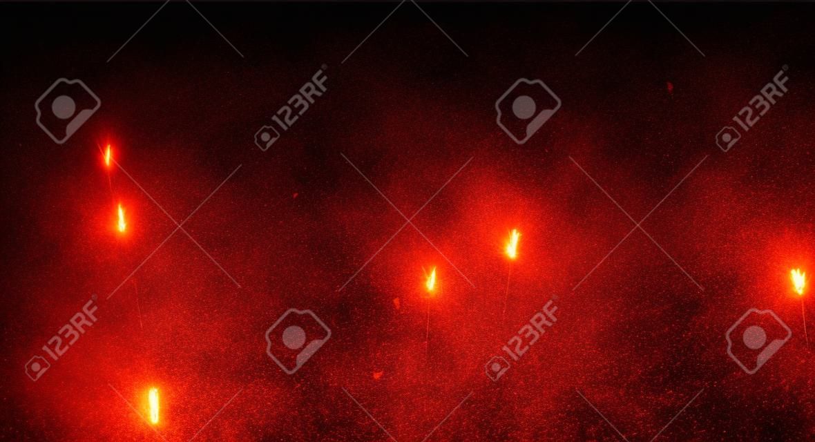 Fire sparks background on a transparent background. Burning hot sparks, embers burning cinder and smoke flying in the air. Realistic heat effect with glow and sparks from bonfire. Flying up embers