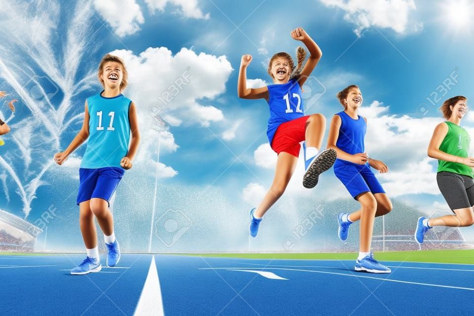 Four happy teenage athletes running on the stadium, bottom view