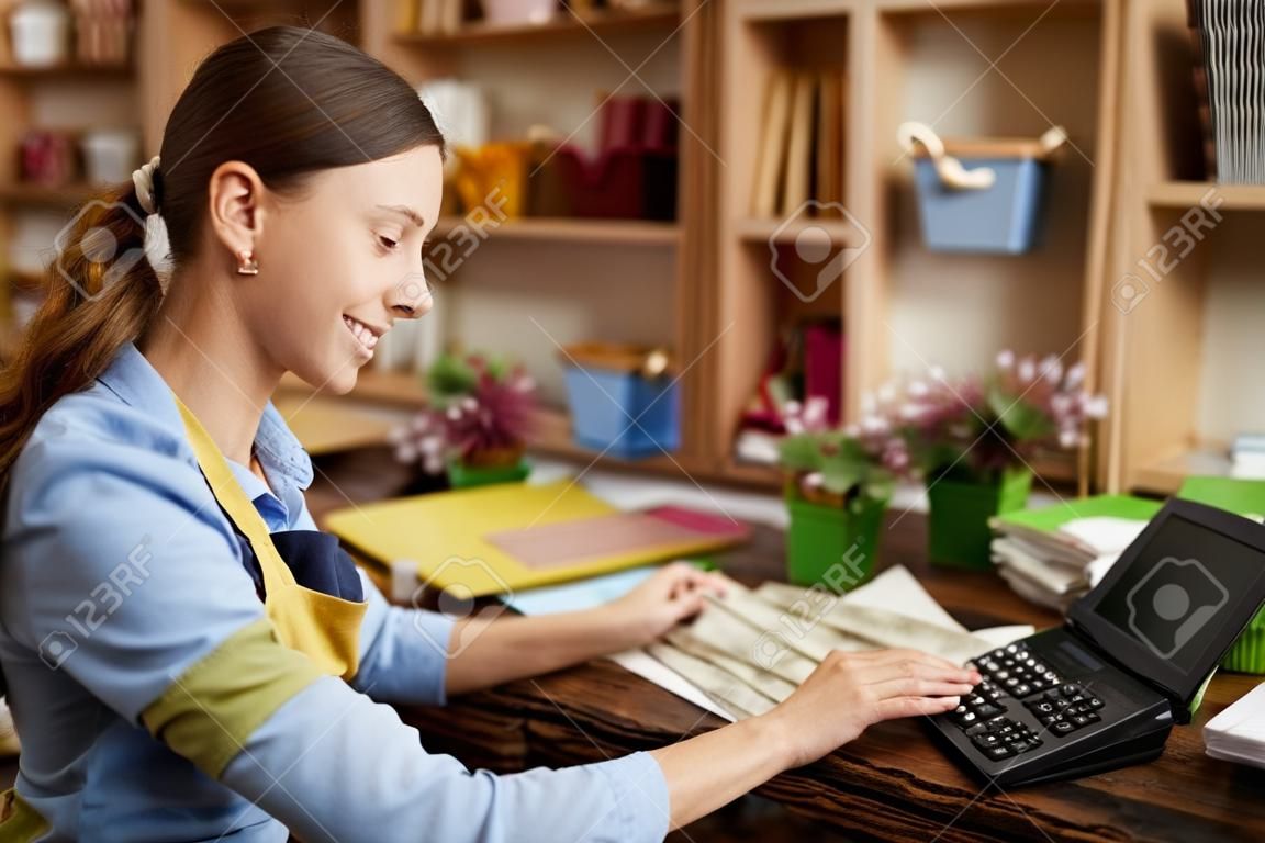 Woman doing Accounting in Shop