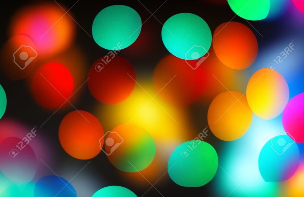 Abstract blurred background and theme: colorful bokeh blurred lights on a dark