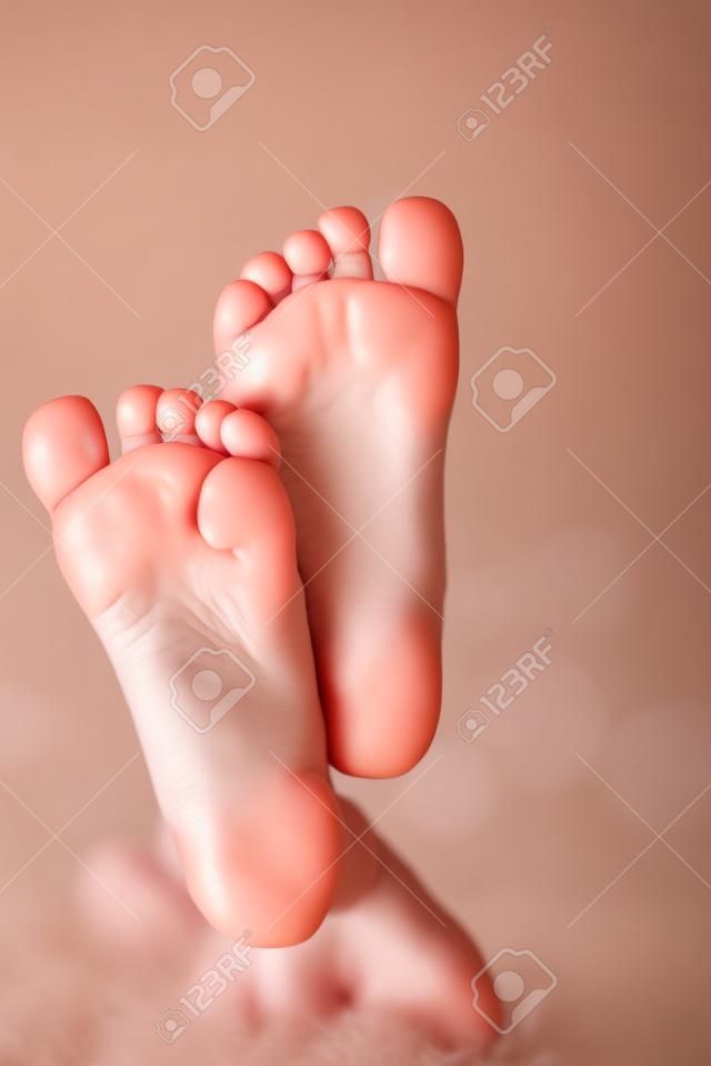Kids toes and heels. Baby shows foots