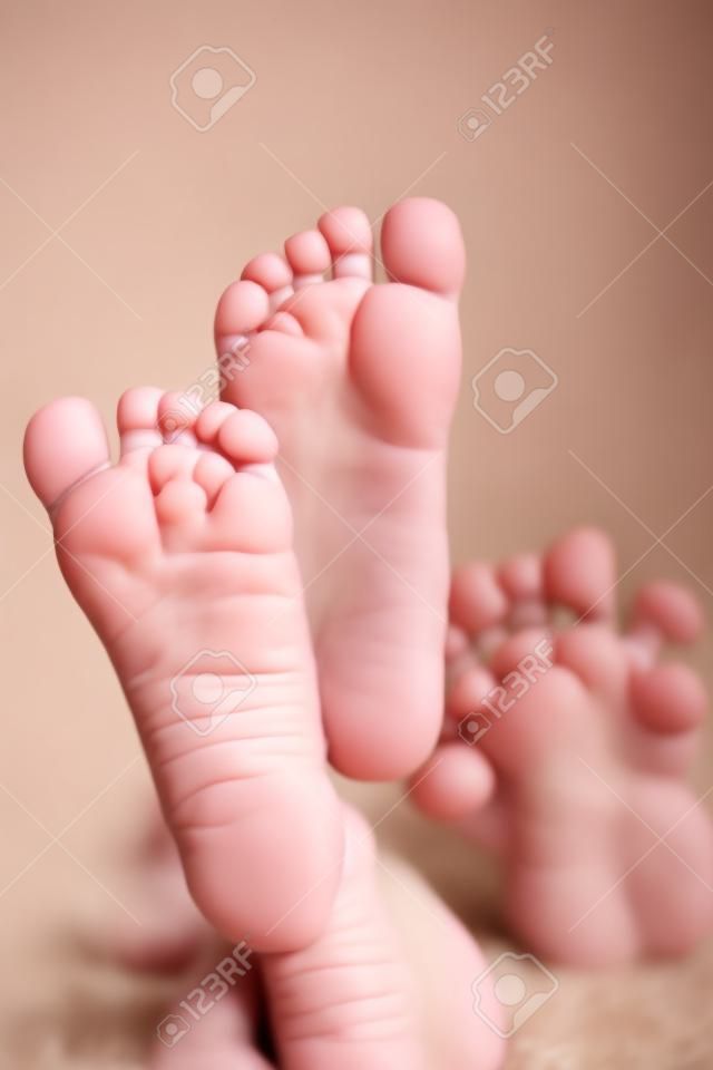 Kids toes and heels. Baby shows foots