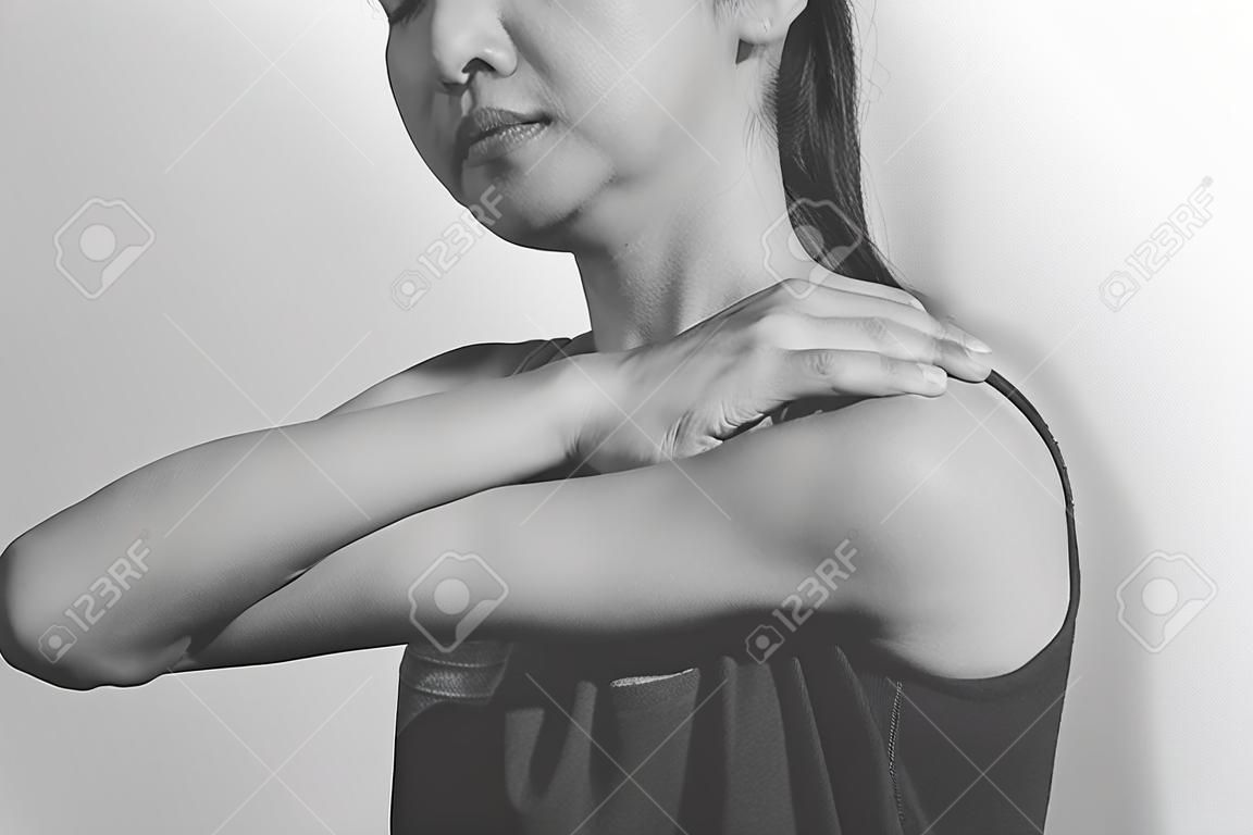 woman shoulder pain, monochrome
