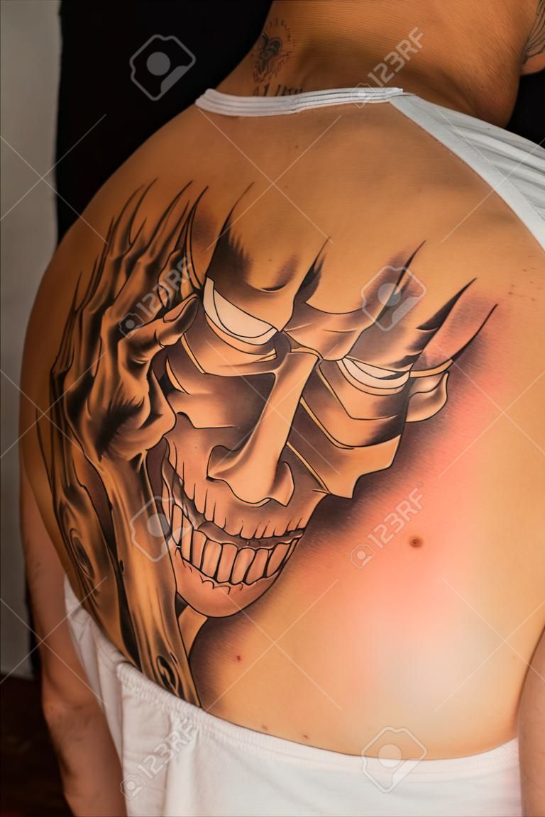 Tattoo on a back of the man