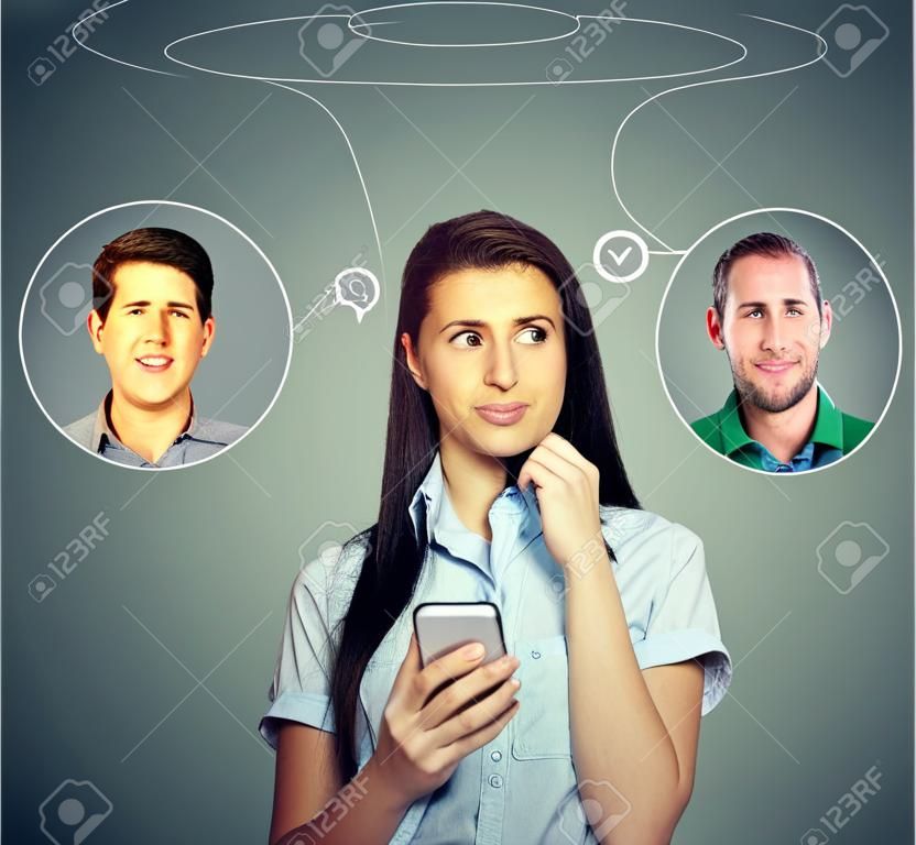 Thoughtful young woman thinking which man she likes loves the most using smartphone app