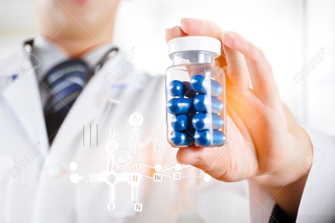 Doctor scientist invented new drug, holds capsule in hands. pill medicine science discovery test formula chemical concept
