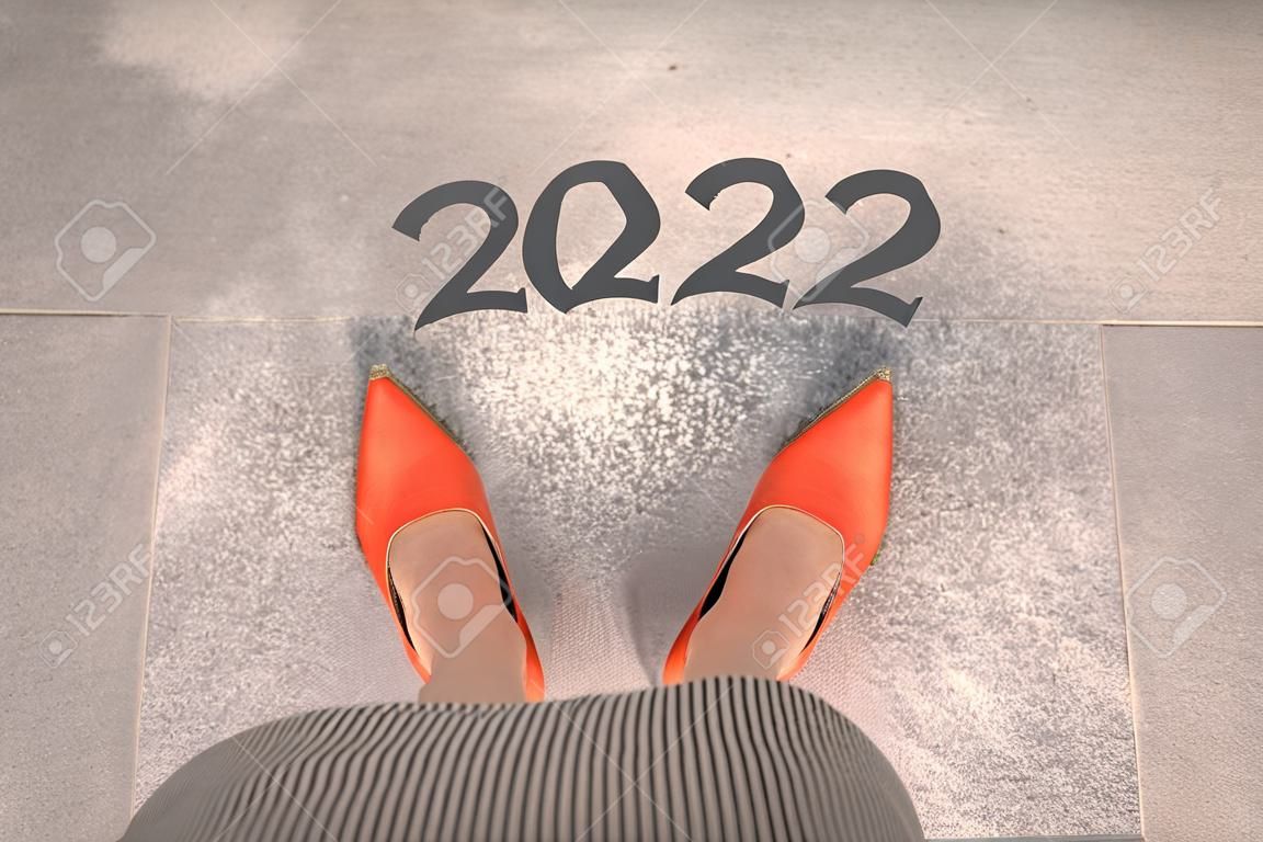 Top view of woman standing with orange shoes. New Year 2022 concept for business and career.