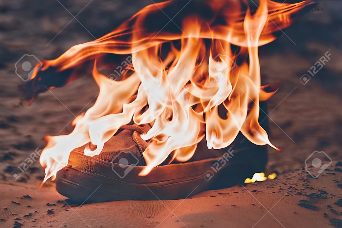 beach sand. Sneakers are very old burn open fire. have toning.