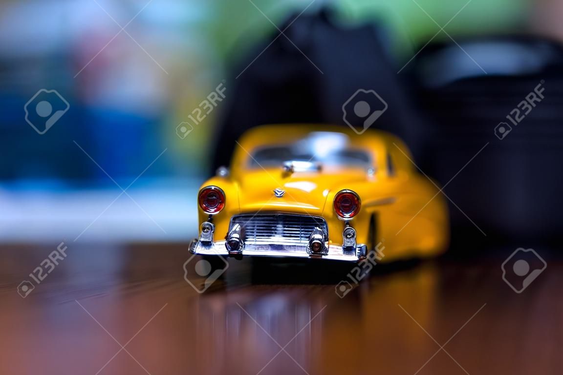 Miniature of a yellow car. extreme closeup.
