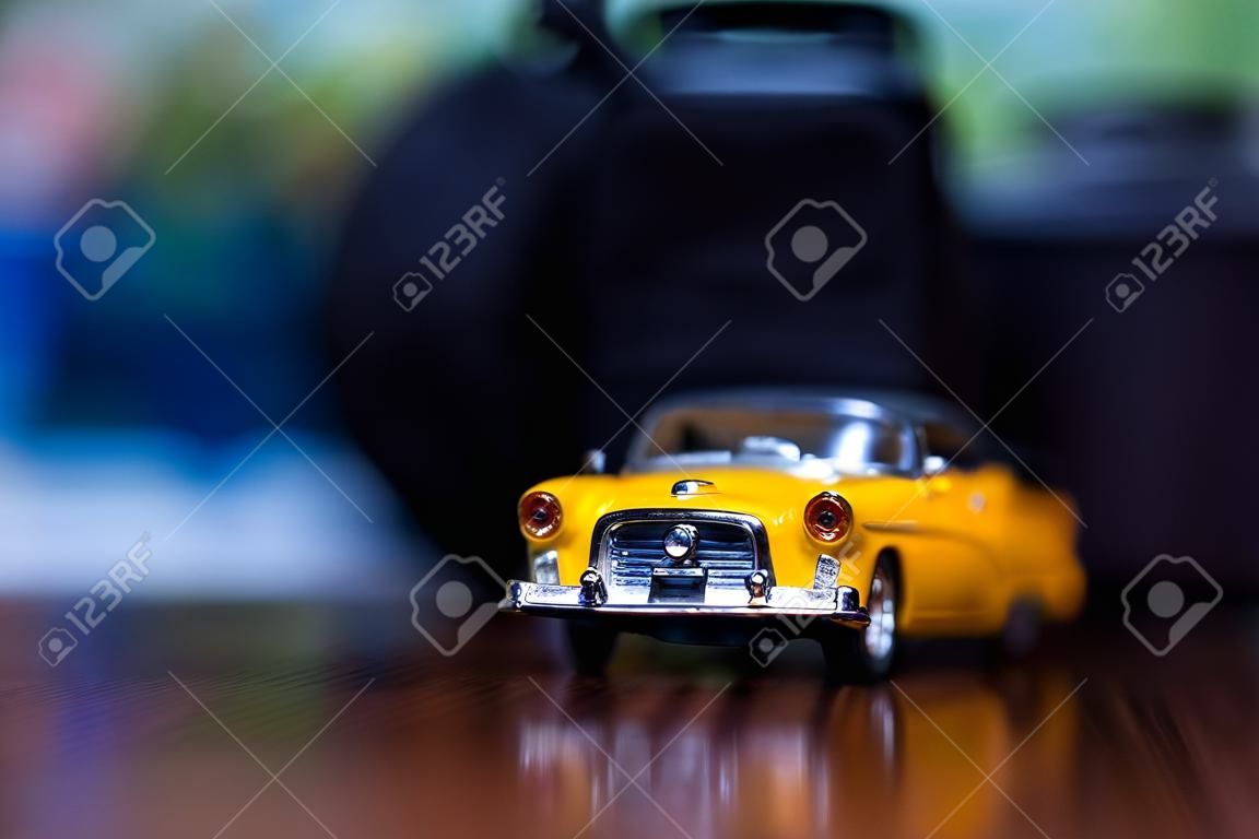 Miniature of a yellow car. extreme closeup.