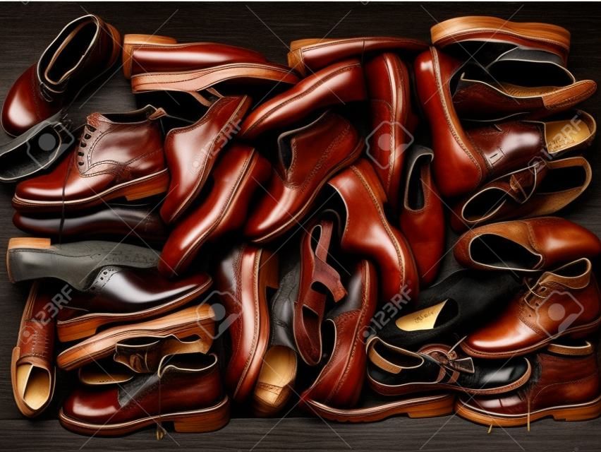 A large number of diverse old shoes        