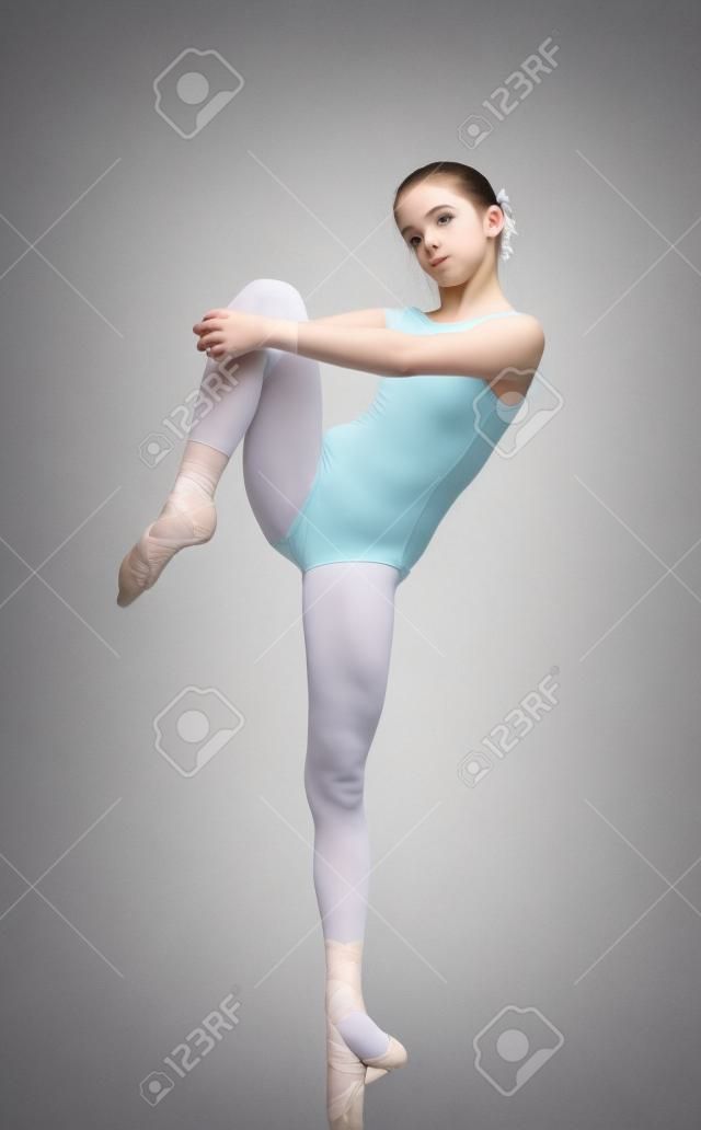 Portrait of cute teen ballet dancer girl isolated on white
