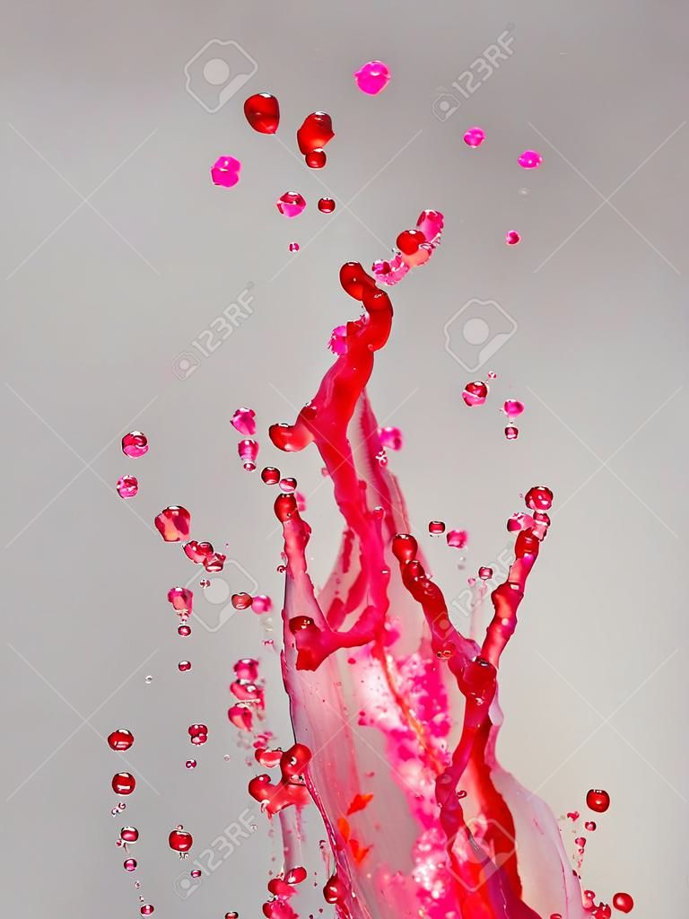 красочные всплеск воды на сером фоне градиента
