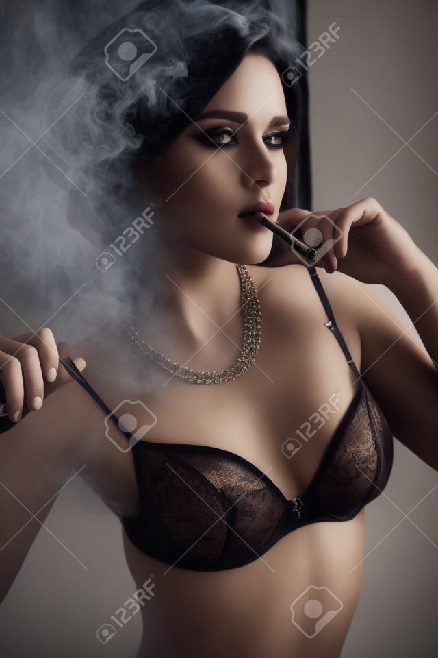 fashion photo of gorgeous woman with long hair in lingerie, smoking ciragette, posing in interior