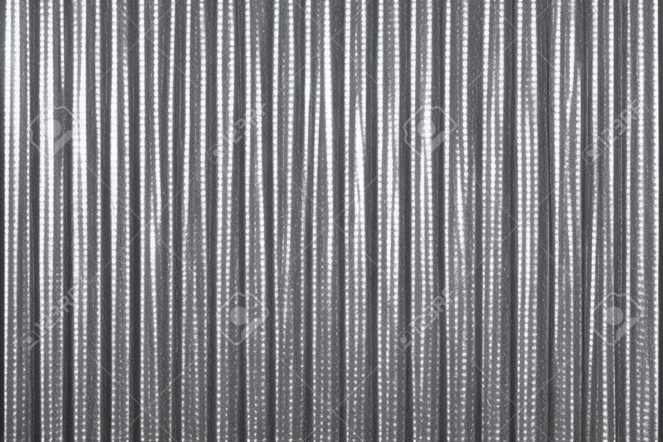 Corrugated zinc metal texture may be used as background.