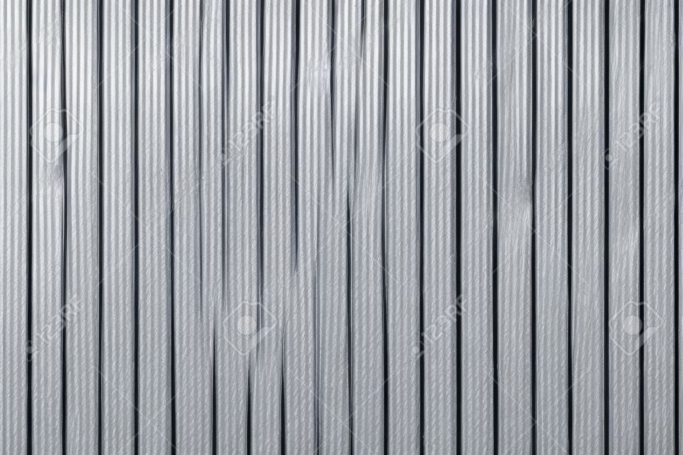 Corrugated zinc metal texture may be used as background.