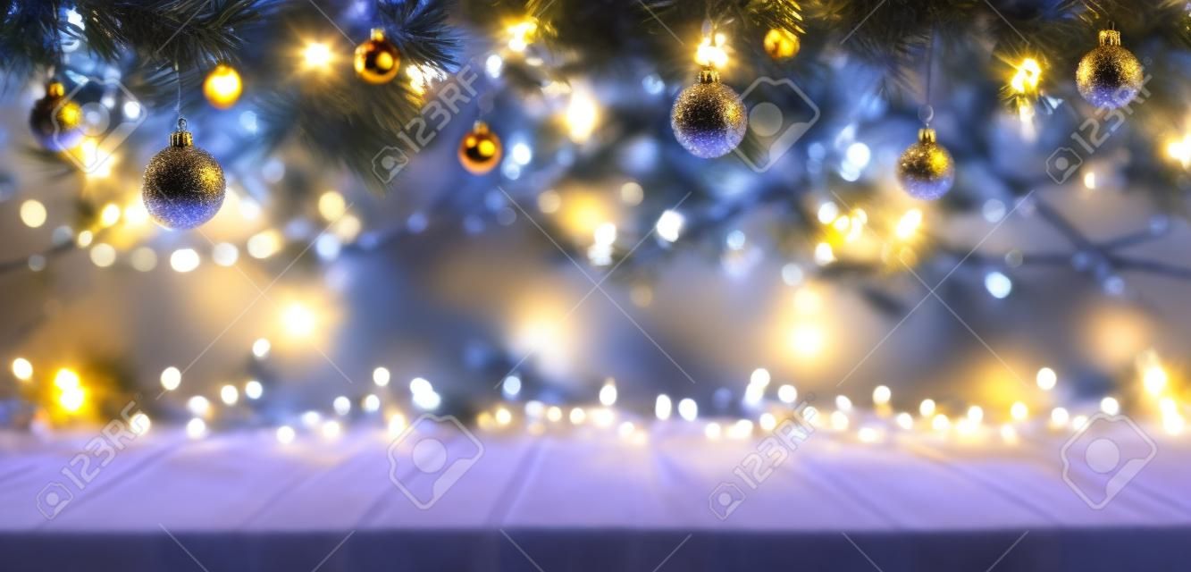Christmas Table - Lights And Ornaments With Fir Branches At Night - Abstract Defocused Elements