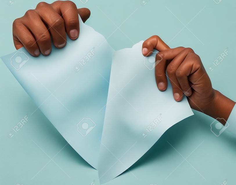 Man hands tear paper  version 2 