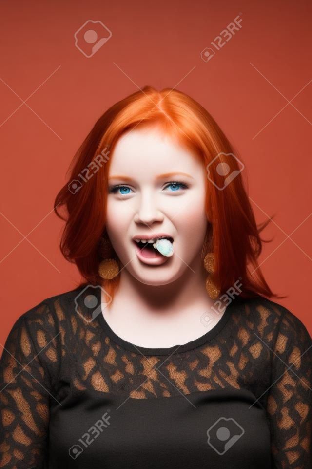 Cute Redhead Girl Showing her Tongue