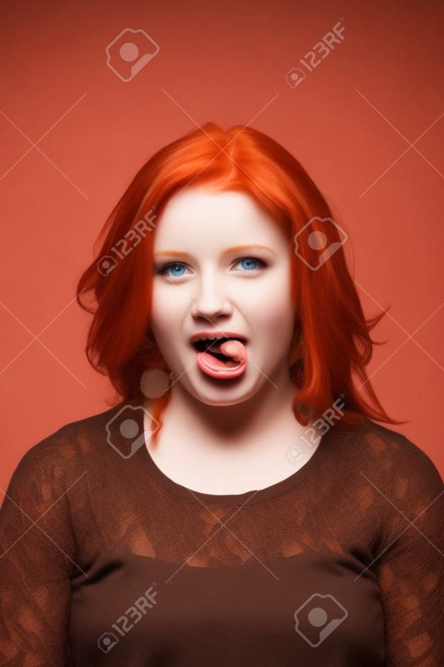 Cute Redhead Girl Showing her Tongue