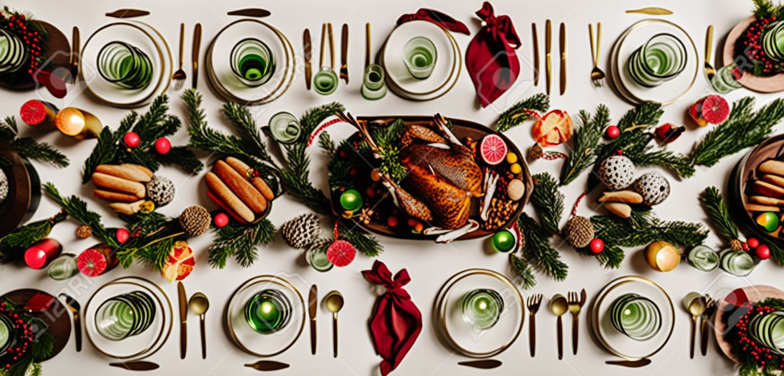 Flat-lay of Festive Christmas table setting over white background