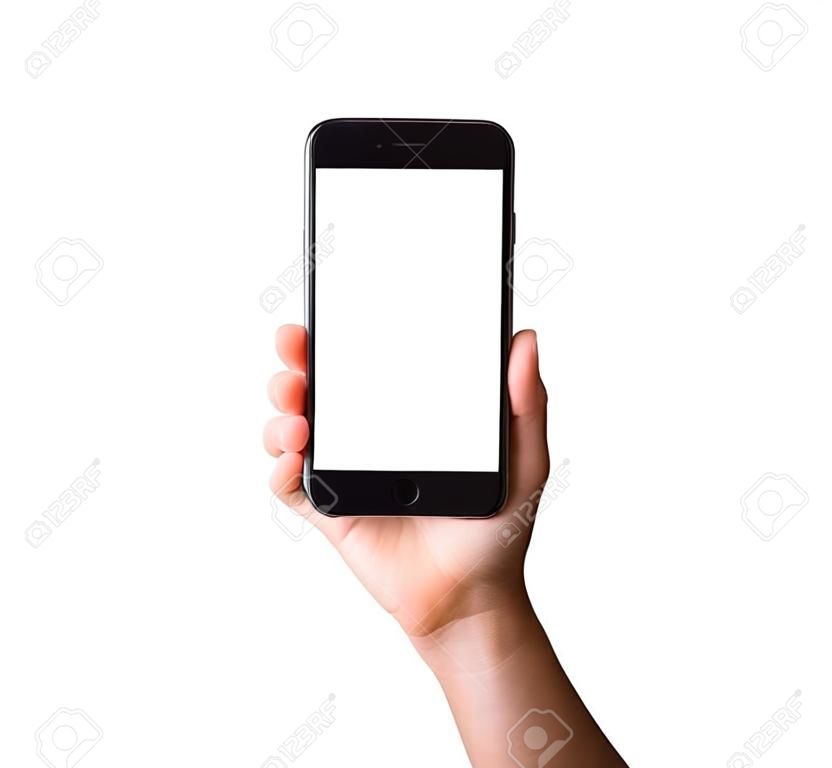 スマートフォンの空白の白い画面を持っている女性の手。女性は、携帯電話と画面上のクリッピングマスクパスで白い背景の上に分離されたスタジオショットを手に現代の携帯電話を保持します