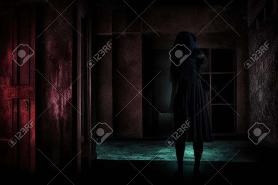 Horror evil woman ghost creepy in a dark room at house. The female devil is scary she haunted at the abandoned building, Happy Halloween day concept