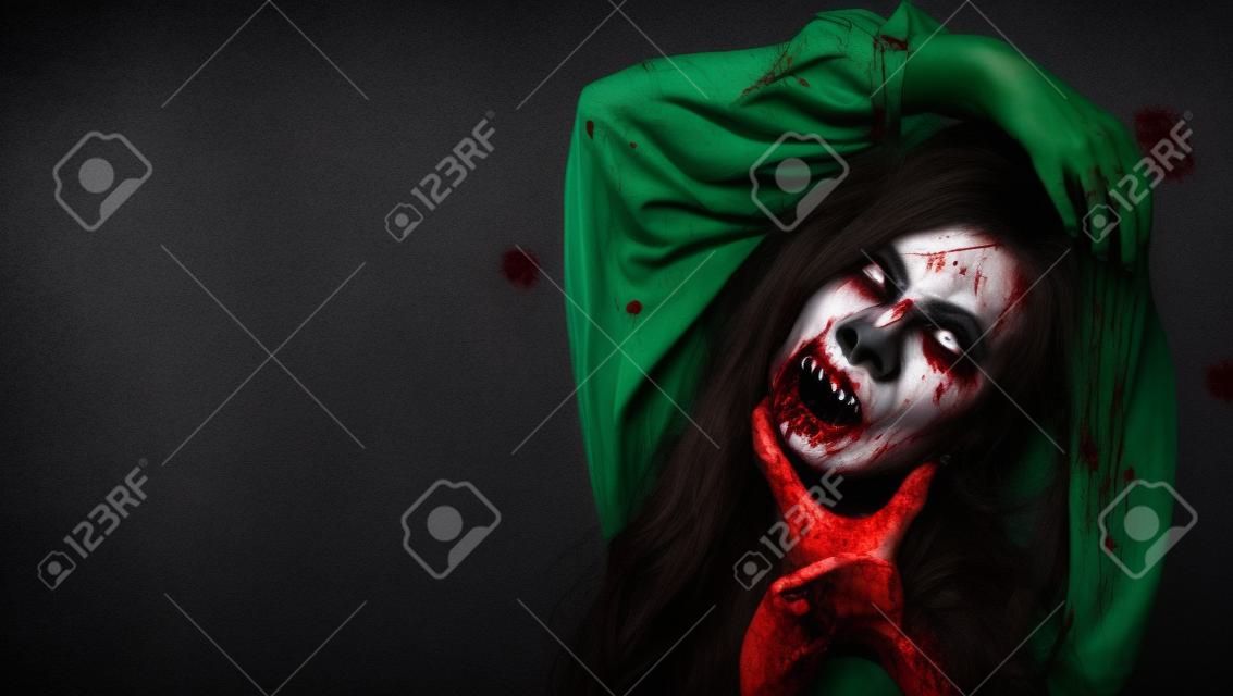 Happy halloween day concept. Screaming zombie female face with blood grabs her head to twist it off, Horror bloodthirsty woman ghost or zombie she is horror scary with breaks her neck at dark night