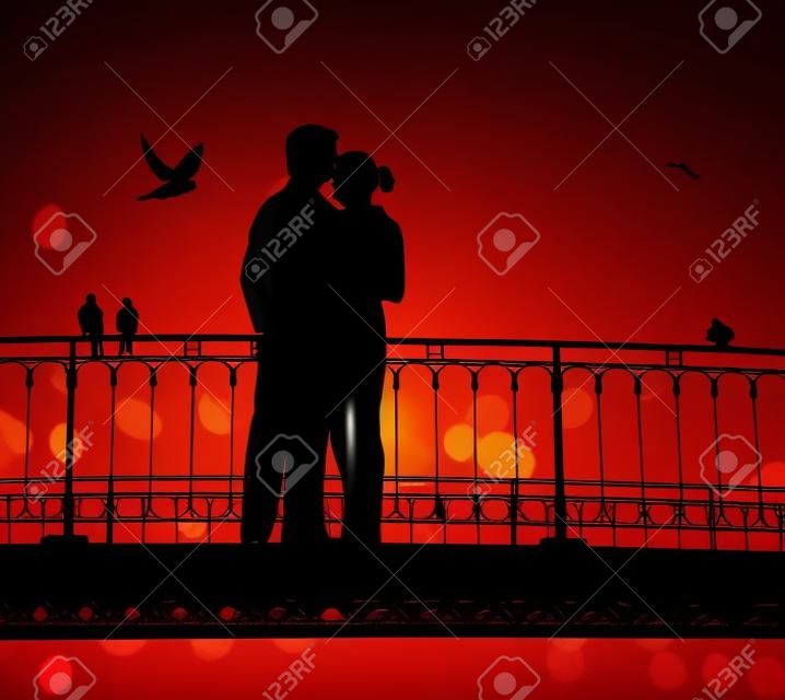 silhouette du pont et paire d'amoureux sur fond de ville