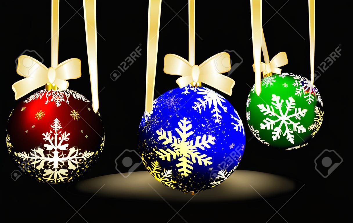 Trzy kolorowe kulki Christmas na czarnym tle