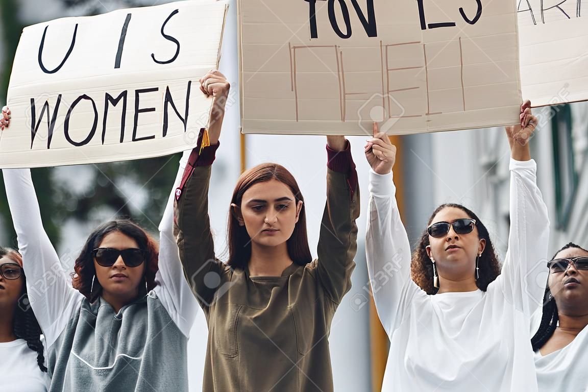 Hear us. Group of feminist women have protest for their rights outdoors.