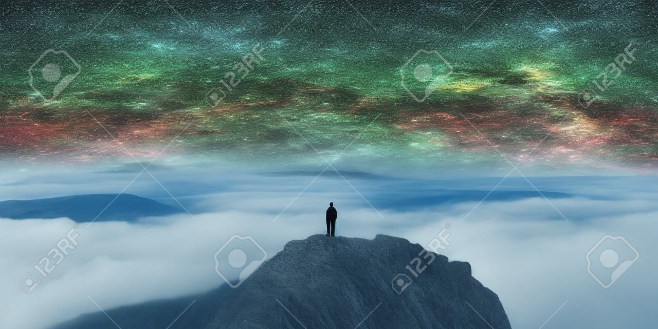 Une personne debout au sommet d'une montagne. image ai générative.