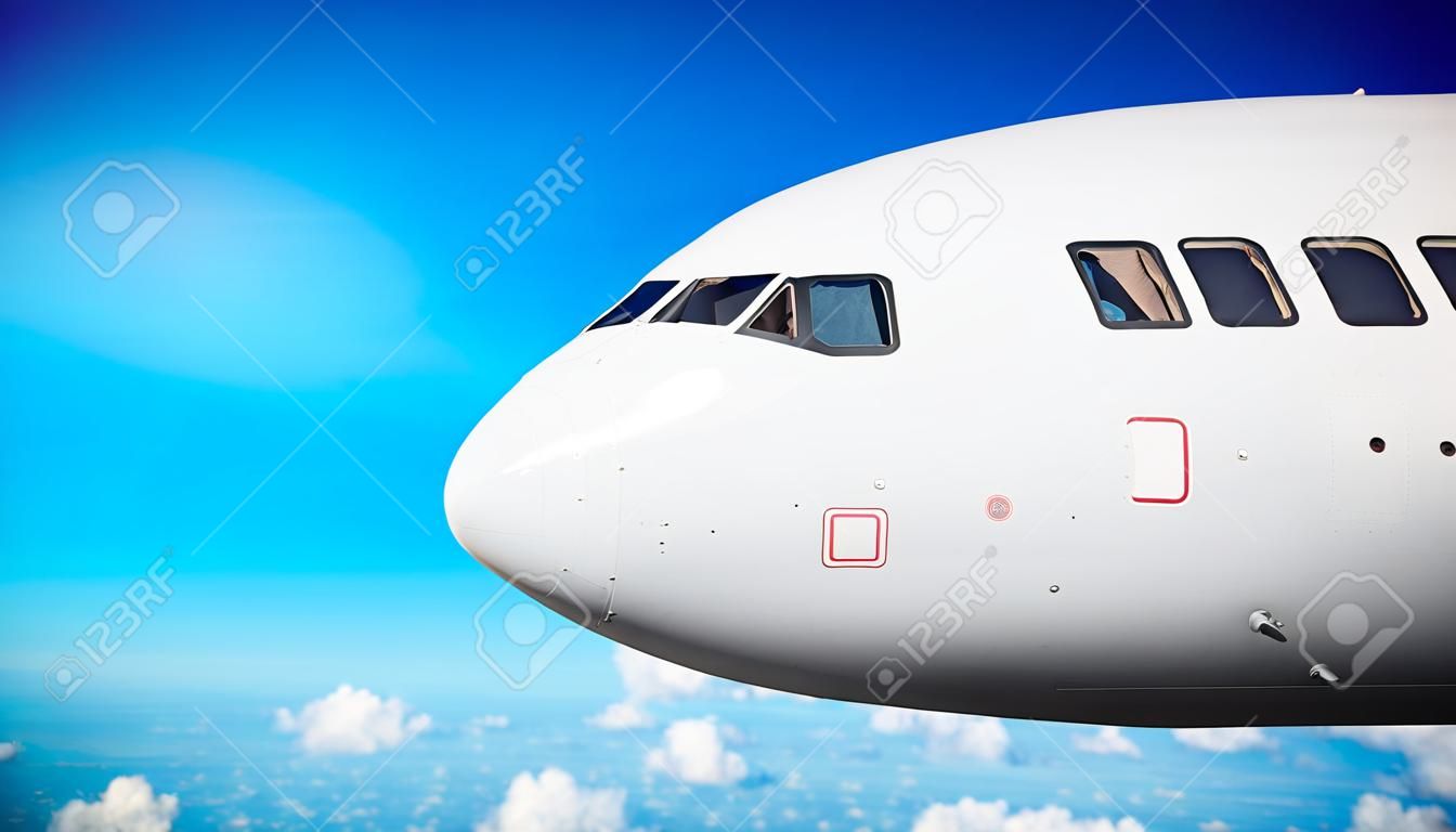 Passenger plane nose close up in flight