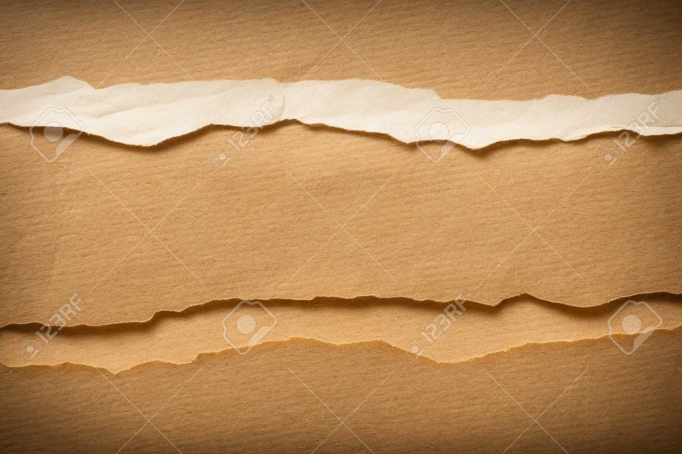 Ripped  paper on brown paper