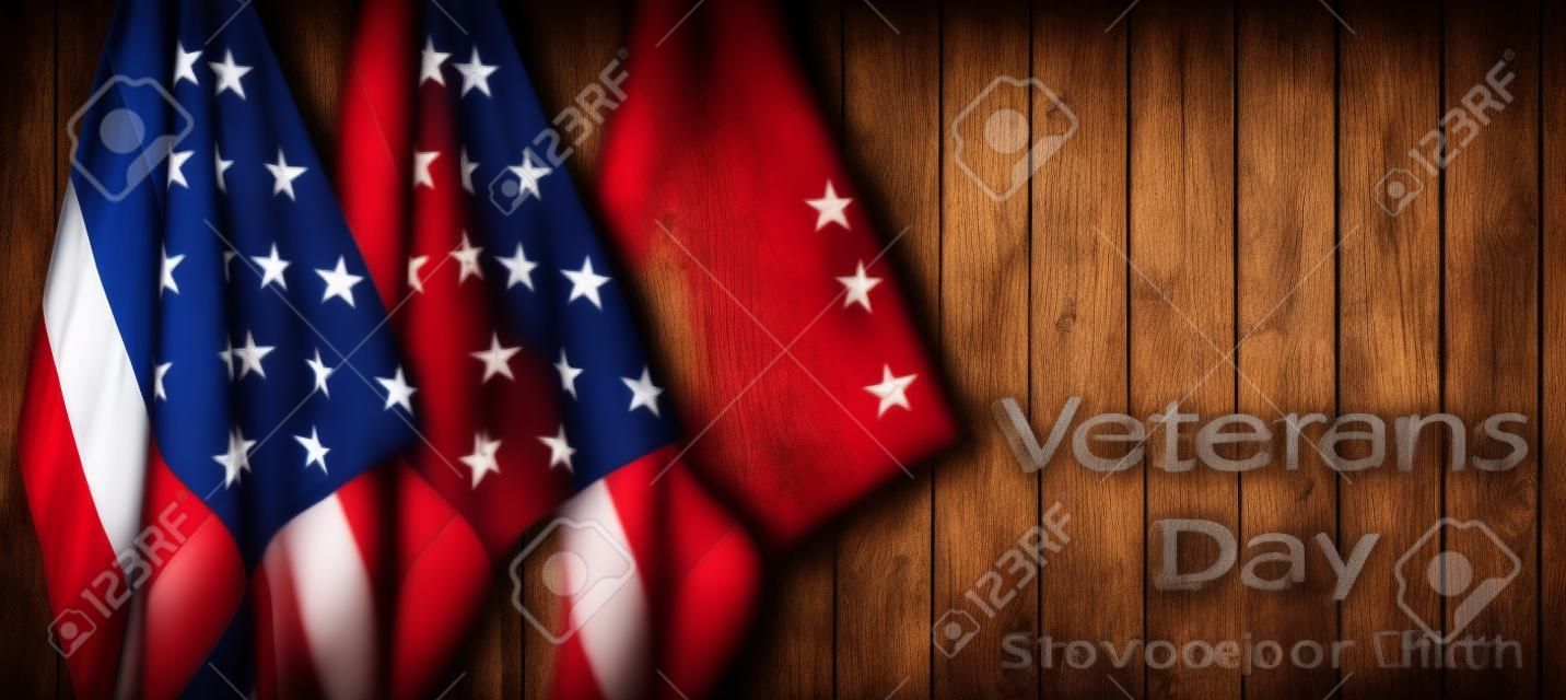 American flags and wooden background. Veterans Day