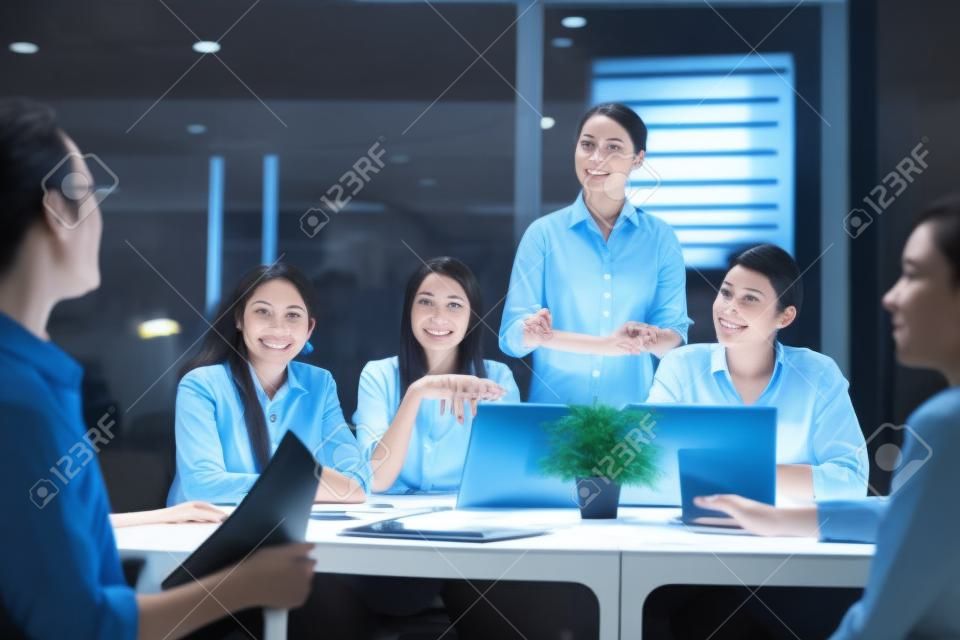 Six office worker meeting at night