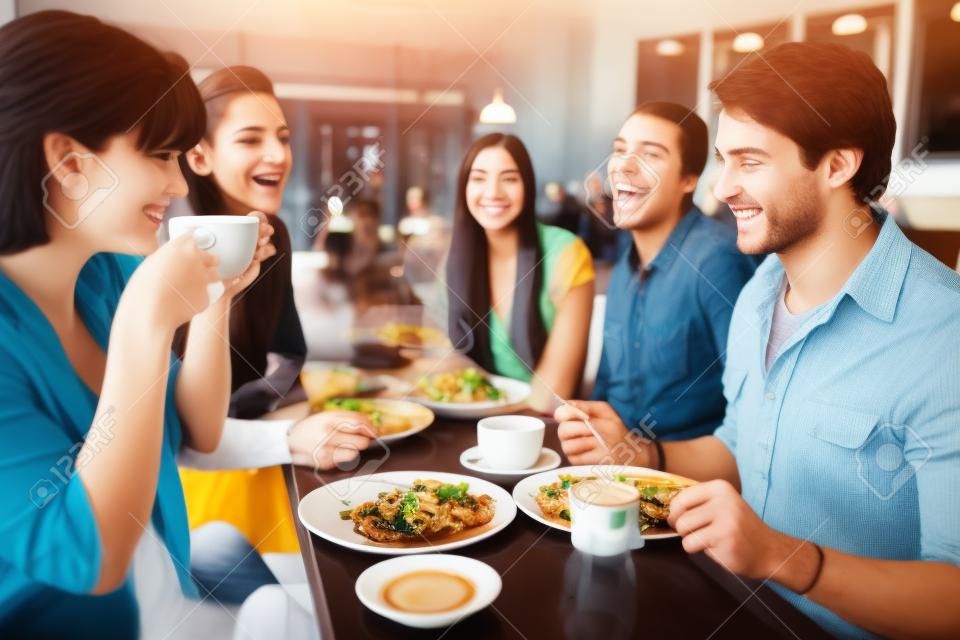 Group Of Friends Meeting For Lunch In Coffee Shop